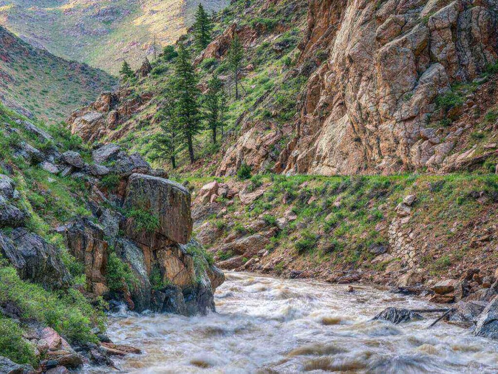 Small town of Lyons, Colorado with river and mountains.