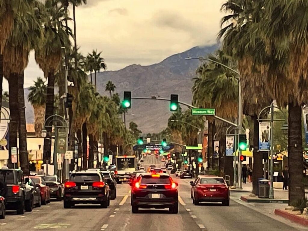 Palm Canyon Drive in downtown Palm Springs with shops and palm trees