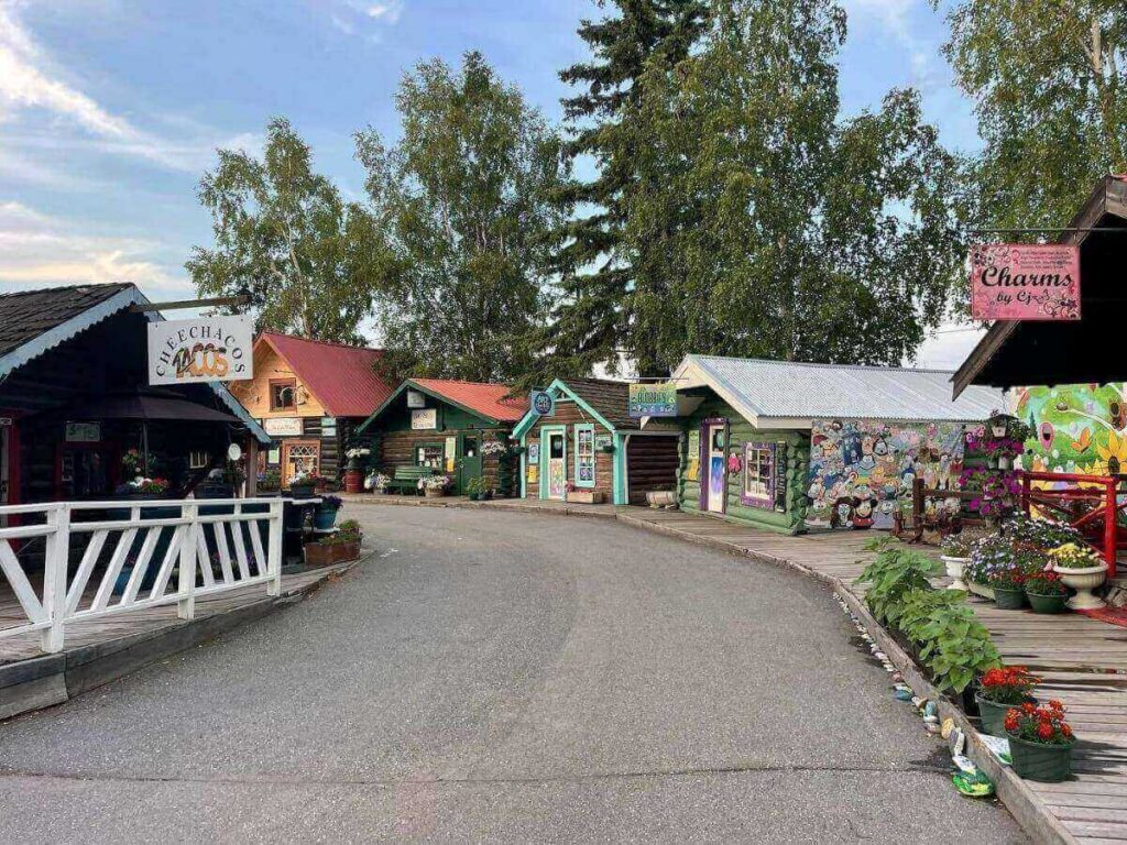 Historic cabins and pathways at Pioneer Park in Fairbanks, Alaska.