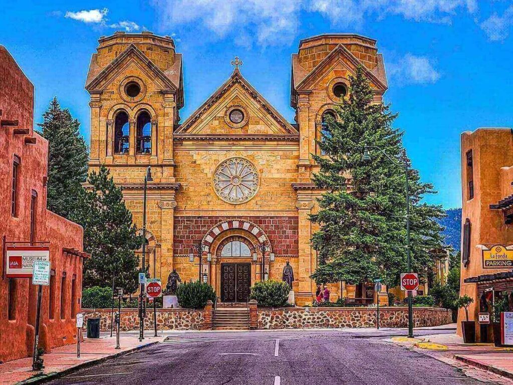 Santa Fe Plaza in the morning with benches, trees, and soft sunlight