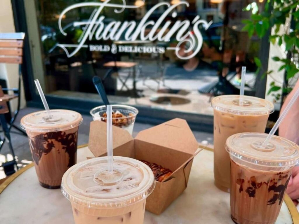 Coffee and pastry on a café table during a slow afternoon break in Savannah