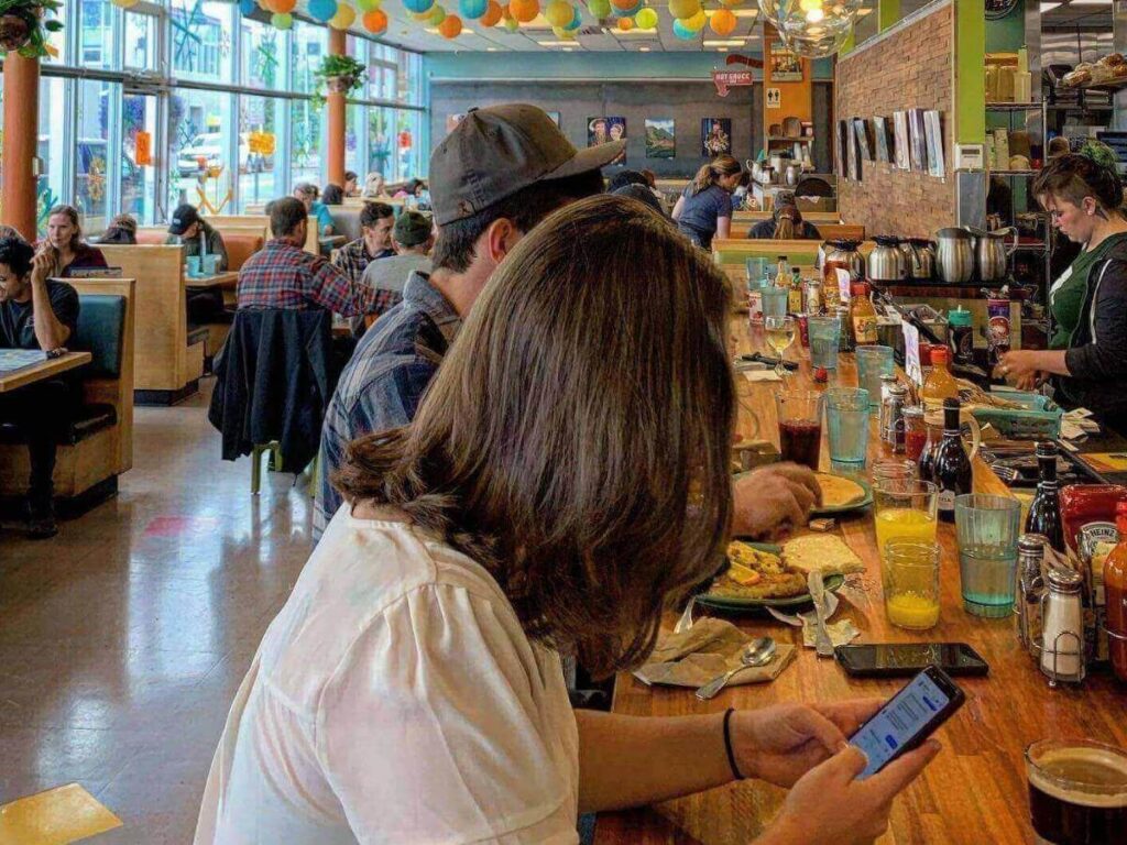 Plate of the Kodiak Benedict with salmon cakes at Snow City Café