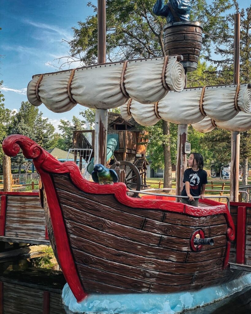 Children playing among fairytale statues at Storybook Island in Rapid City
