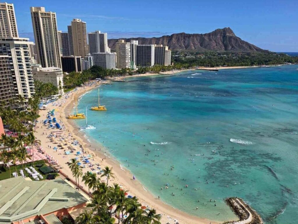 Early morning at Waikiki Beach with calm water and fewer crowds