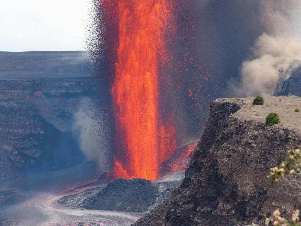 Aerial view of lava fields and volcanic craters in Hawaii Volcanoes National Park