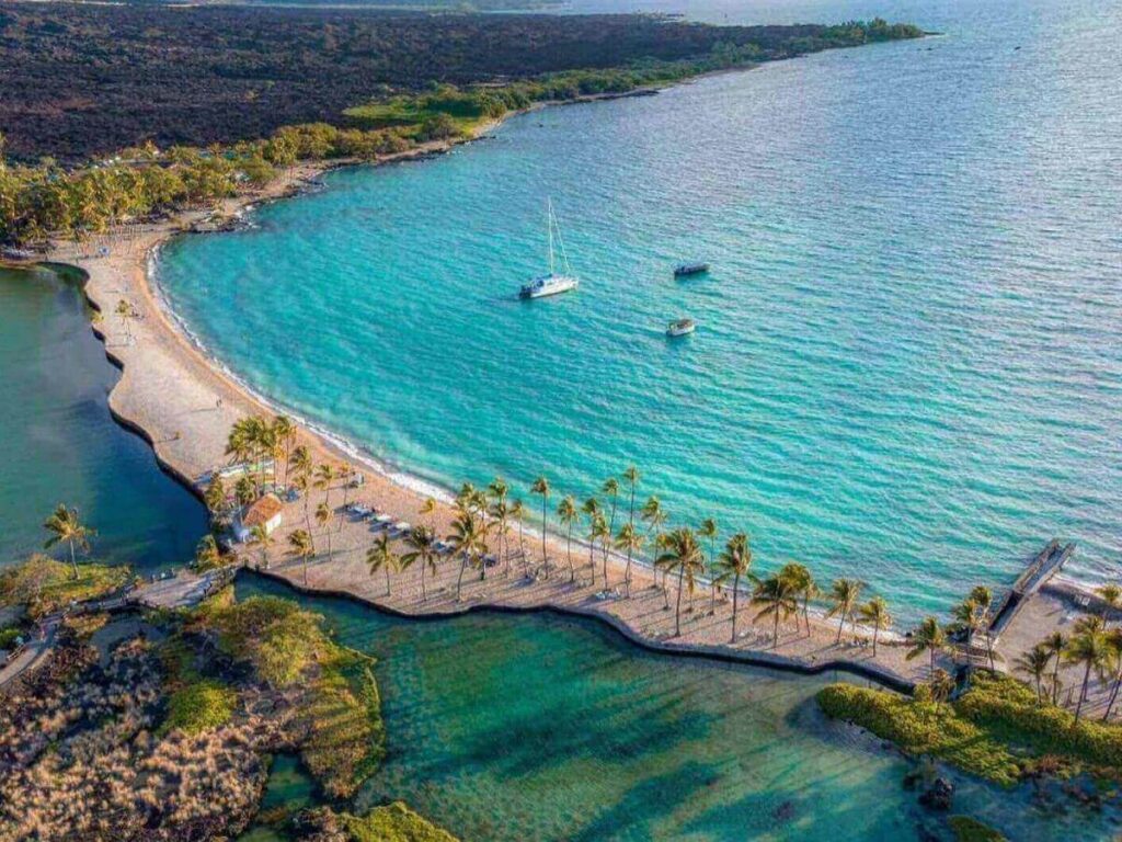 Calm morning at Anaehoʻomalu Bay in Waikoloa with clear water and soft light