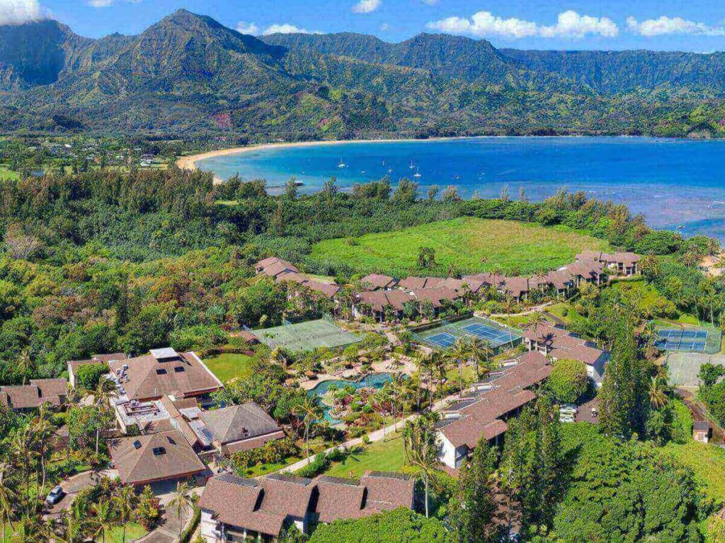 Hanalei Bay on Kauai with mountains rising behind the shoreline