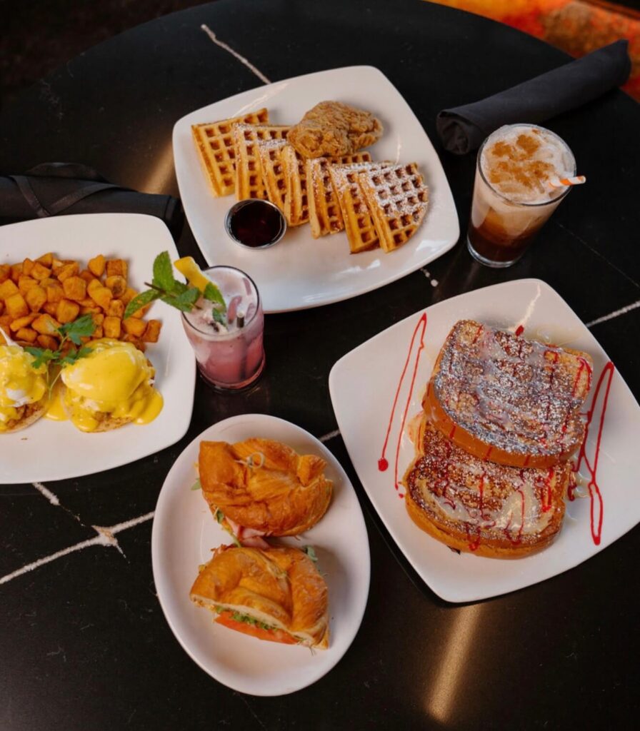 Brunch with pancakes, eggs Benedict, and coffee at a Chicago café