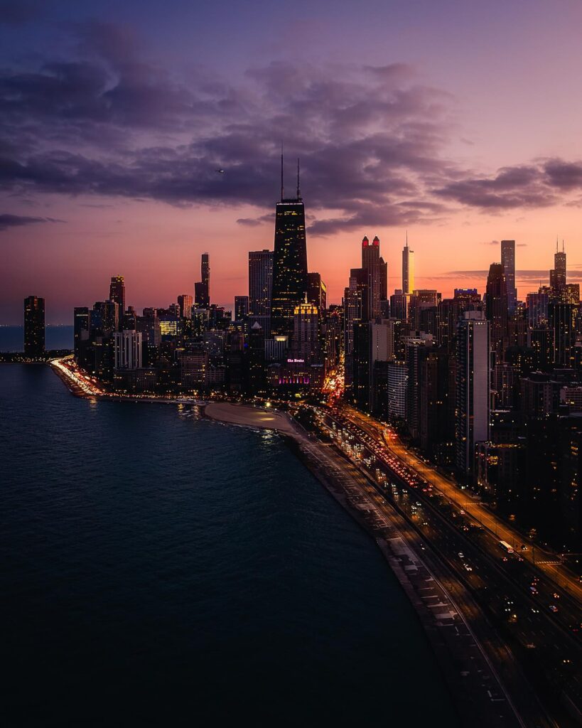 Chicago skyline illuminated at dusk viewed from the lakefront