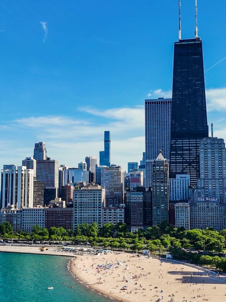 Chicago skyline viewed from the shores of Lake Michigan at sunset
