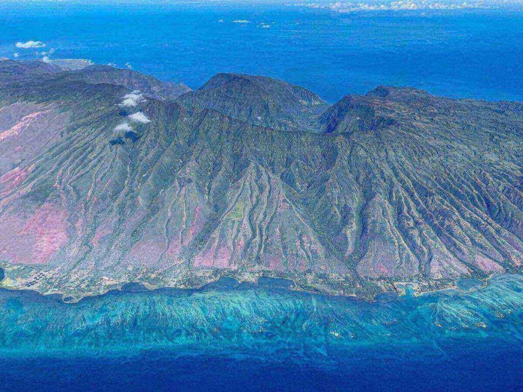 Lush green coastline on the east side of Molokai with dramatic cliffs