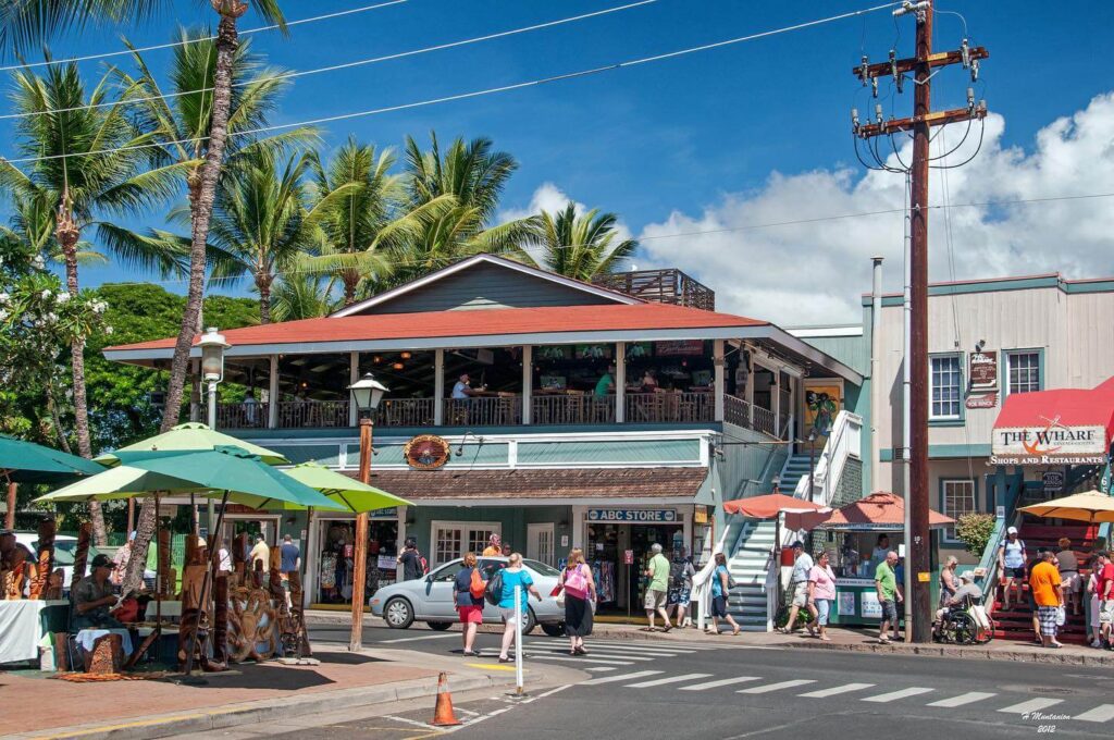 Front Street in Lahaina lined with shops, art galleries, and palm trees.