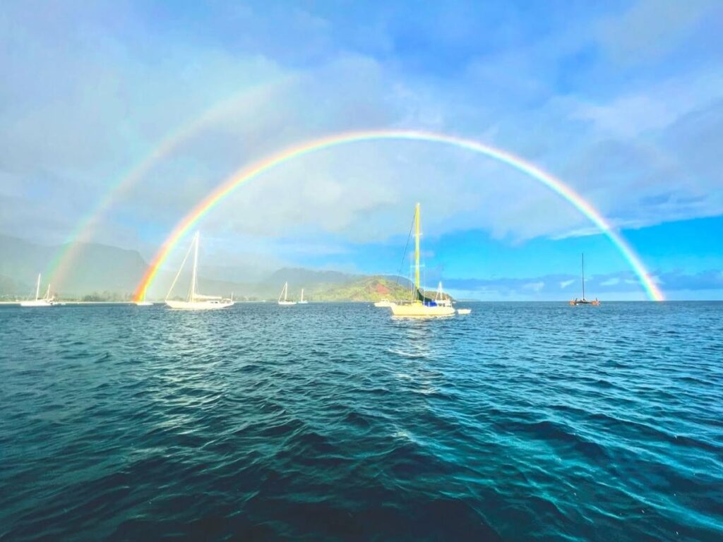 Hanalei Bay beach with mountains on the North Shore of Kauai