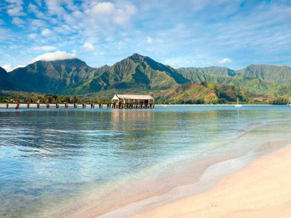 Hanalei Bay on Kauai North Shore with lush mountains and wide sandy beach