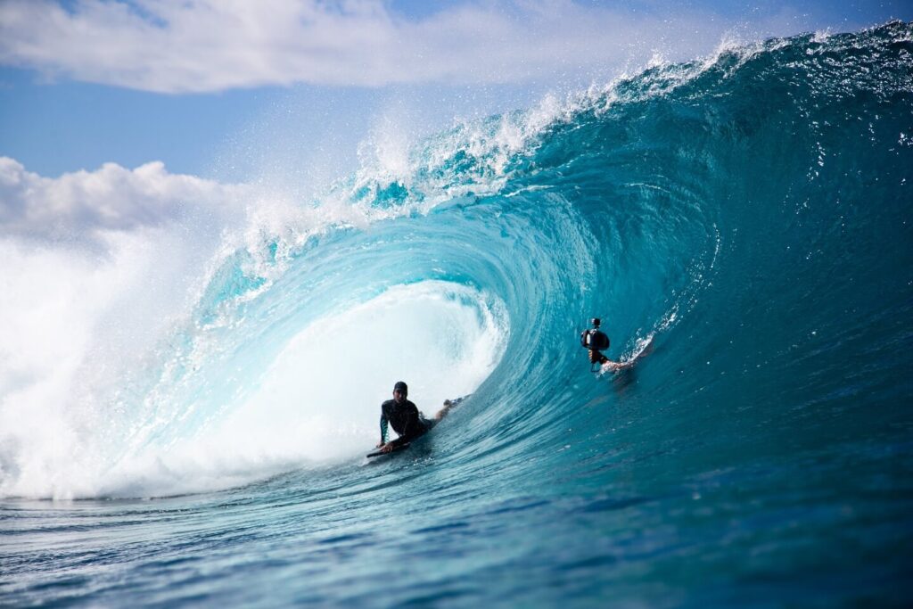 Surfers enjoying the waves at Hanalei Bay on Kauai