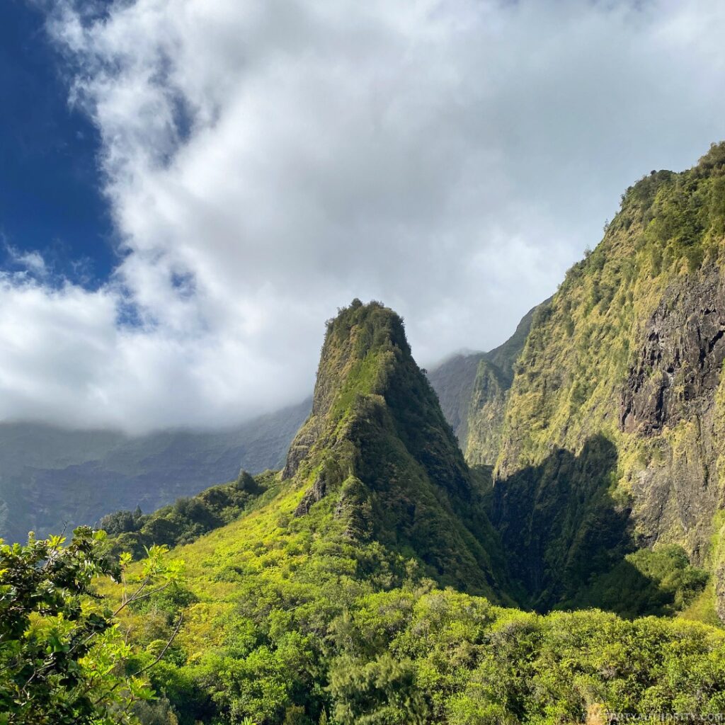 Misty mountains and the Iao Needle surrounded by lush greenery