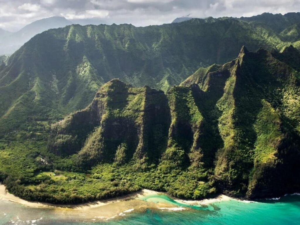 Rain clouds over green mountains on Kauai’s North Shore