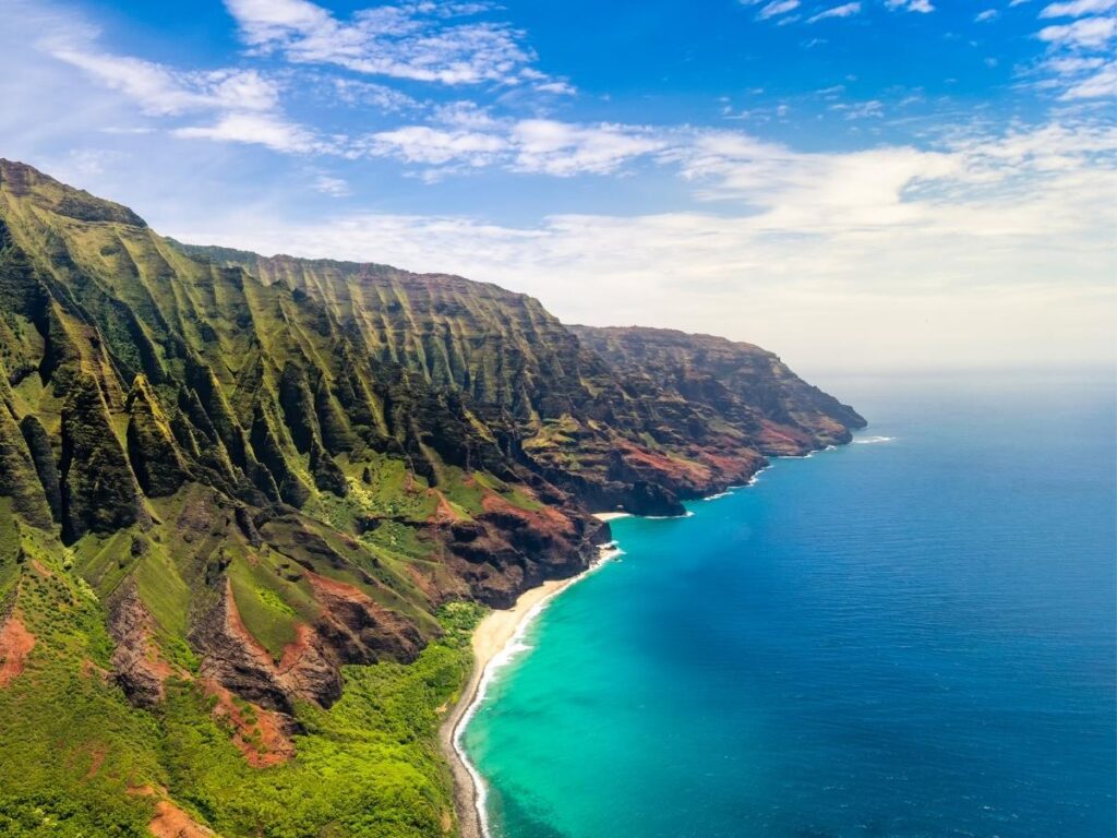 Scenic coastal drive in Kauai with mountains and ocean views