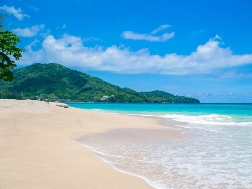 Kawili Beach beside Kaunakakai Harbor with fishing boats and calm waterfront