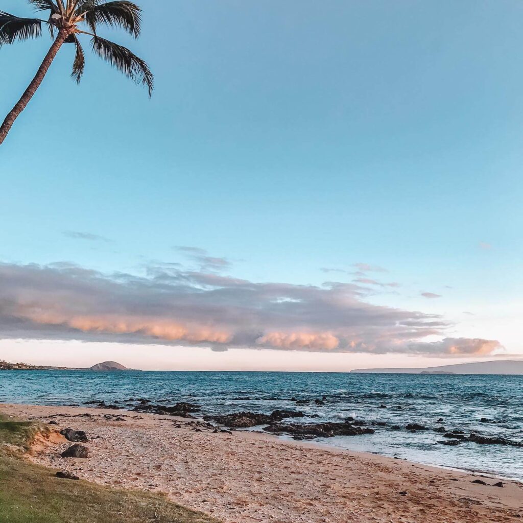 Calm turquoise waters and golden sand at Keawakapu Beach in the morning light