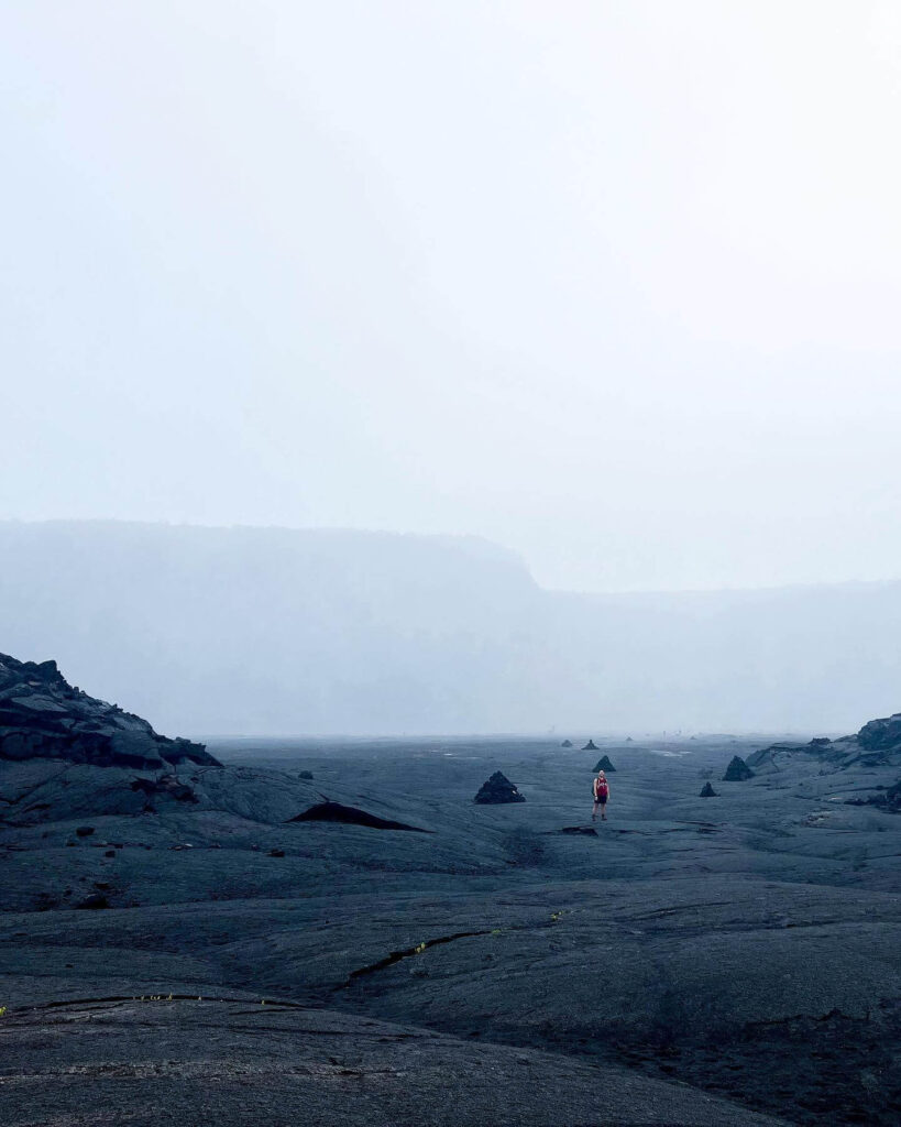 Wide view of Kīlauea Iki crater surrounded by steep volcanic walls