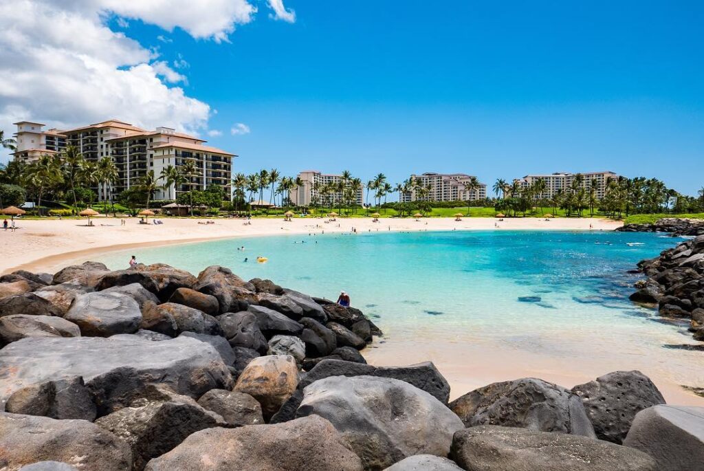 Calm waters of Ko Olina Lagoon with palm trees
