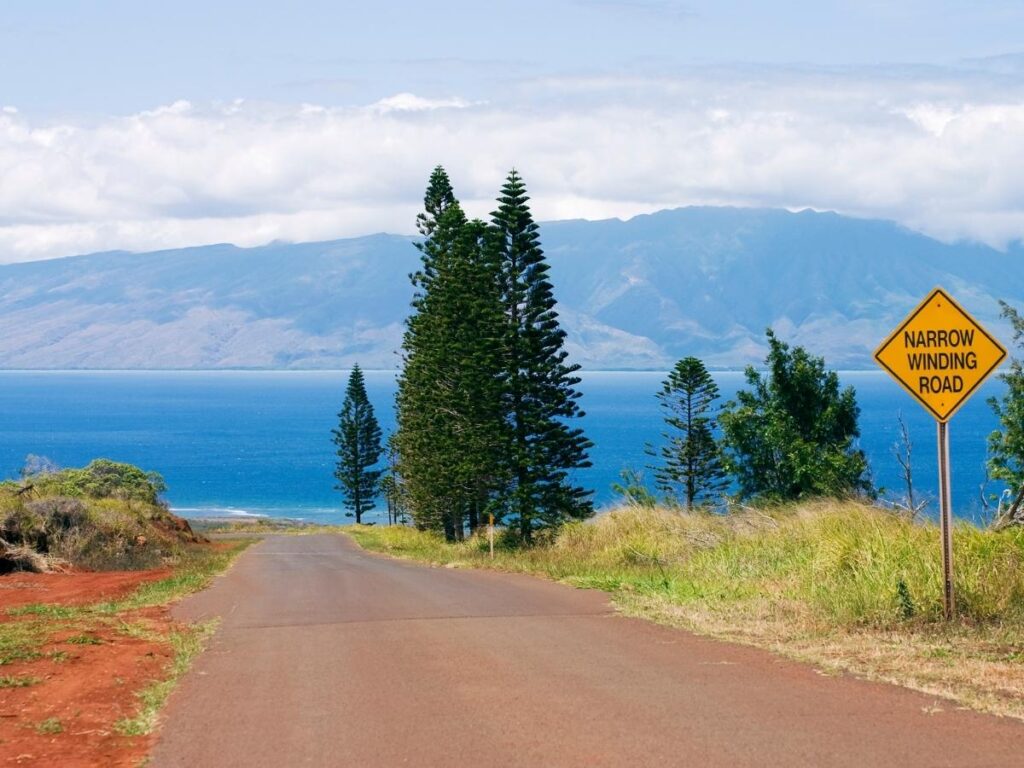 Quiet scenic road with red dirt landscape on Lanai, Hawaii