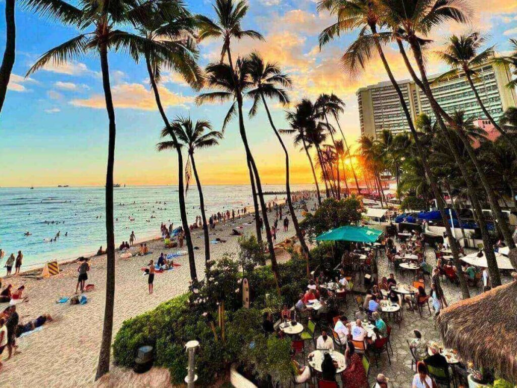 Calm turquoise water and soft white sand at Lanikai Beach in Oahu at sunrise