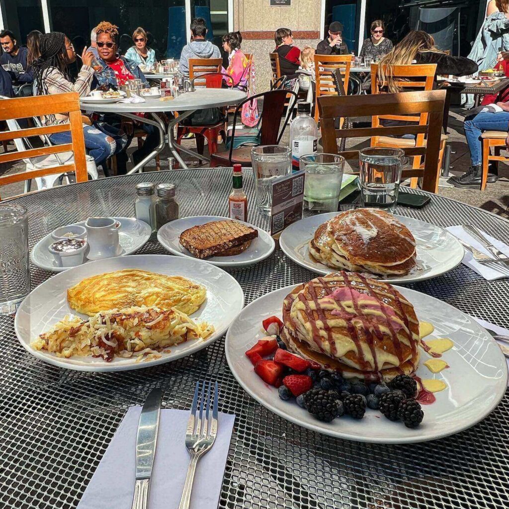 Brunch with pancakes, eggs Benedict, coffee, and fresh fruit in Lincoln Park