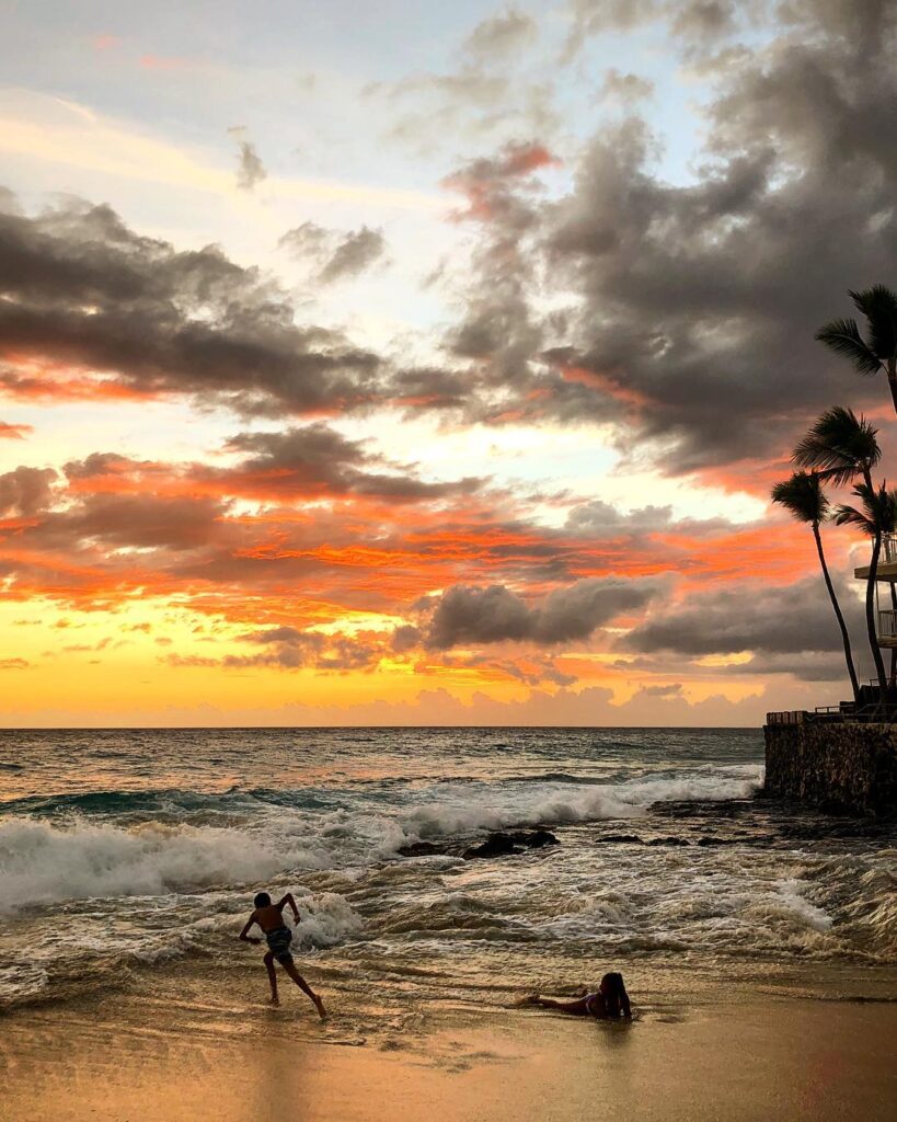 Sunset over waves at Magic Sands Beach in Kona