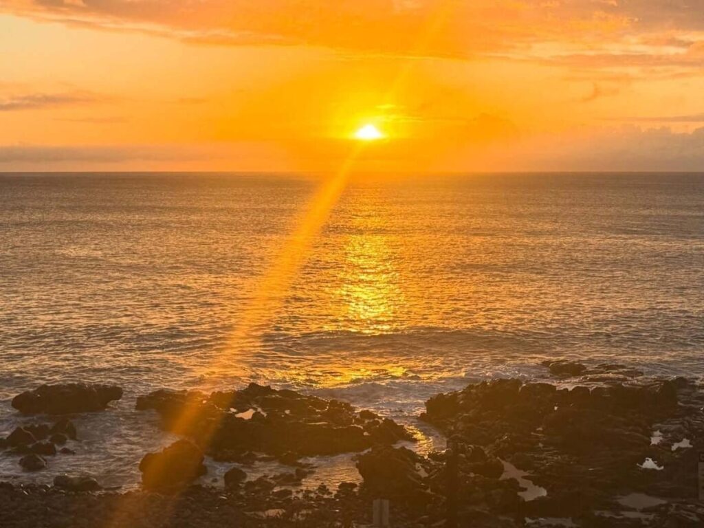 Peaceful Molokai sunset over calm ocean without crowds