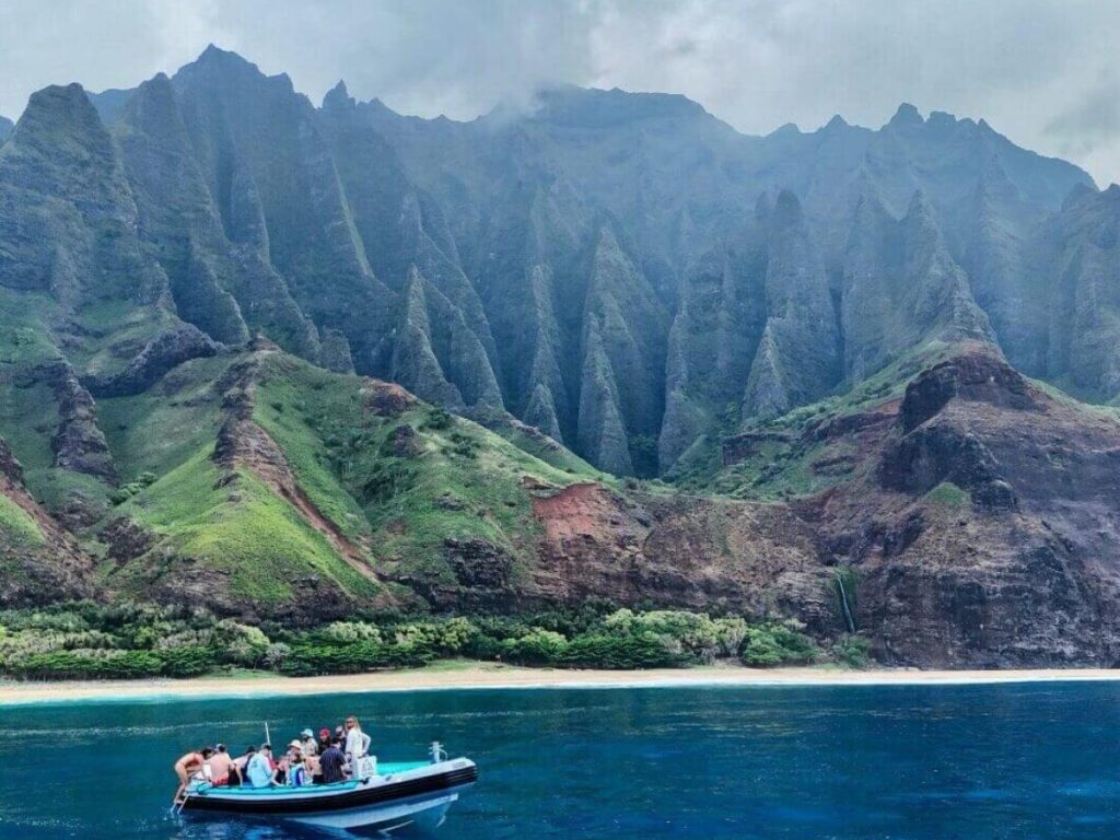 Jagged Na Pali Coast cliffs rising from the ocean in Kauai