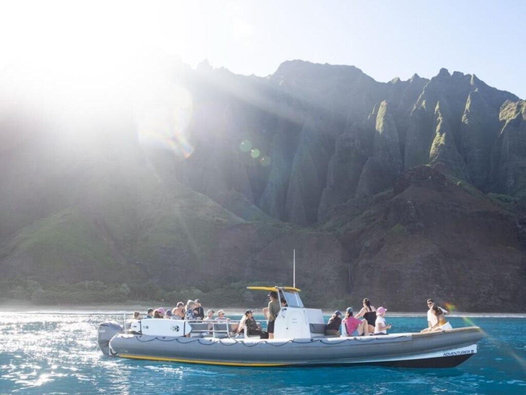 Boat tour along the Na Pali Coast cliffs in Kauai Hawaii
