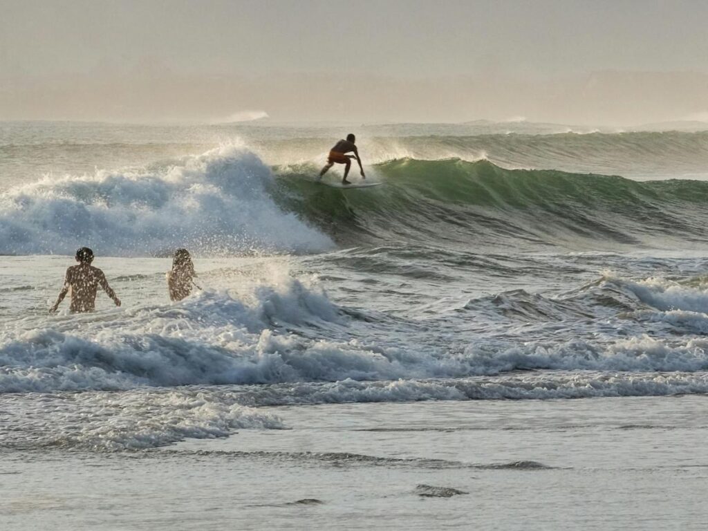 Large winter waves and rough surf at Polihale State Park on Kauai