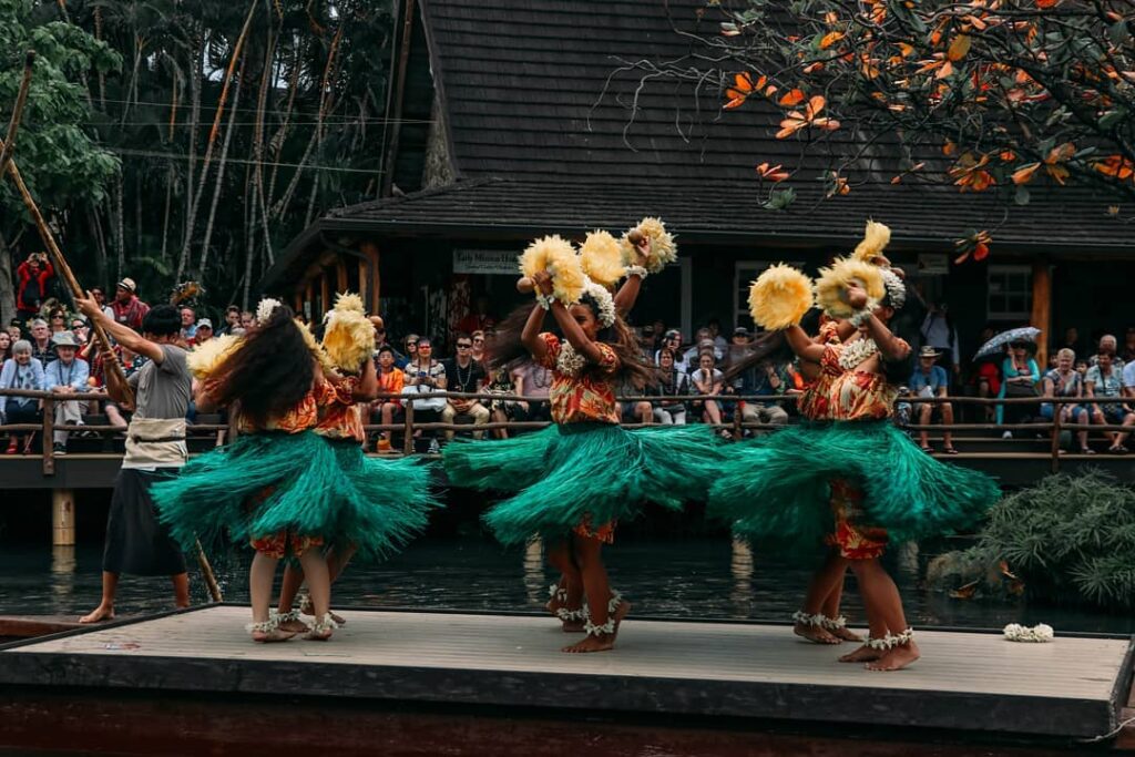 Dancers performing on canoes at the Polynesian Cultural Center