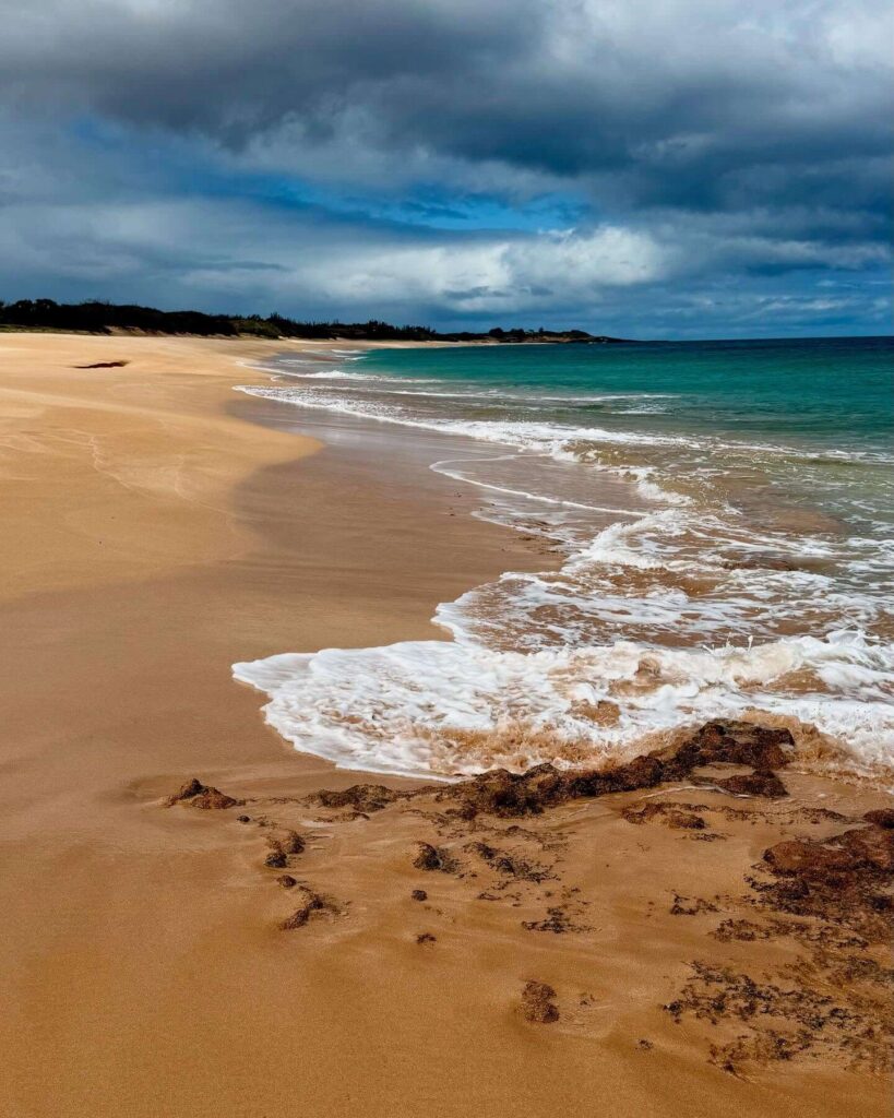 Quiet sandy beach on Molokai with few visitors and peaceful coastline