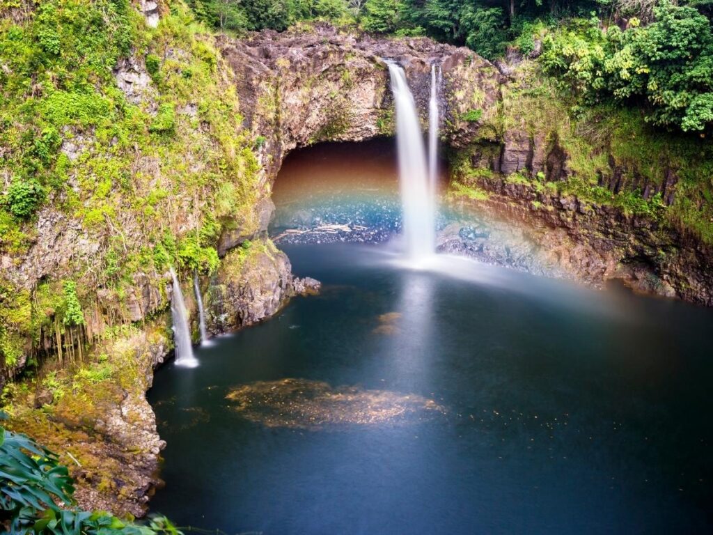 Rainbow Falls surrounded by tropical rainforest near Hilo on the Big Island