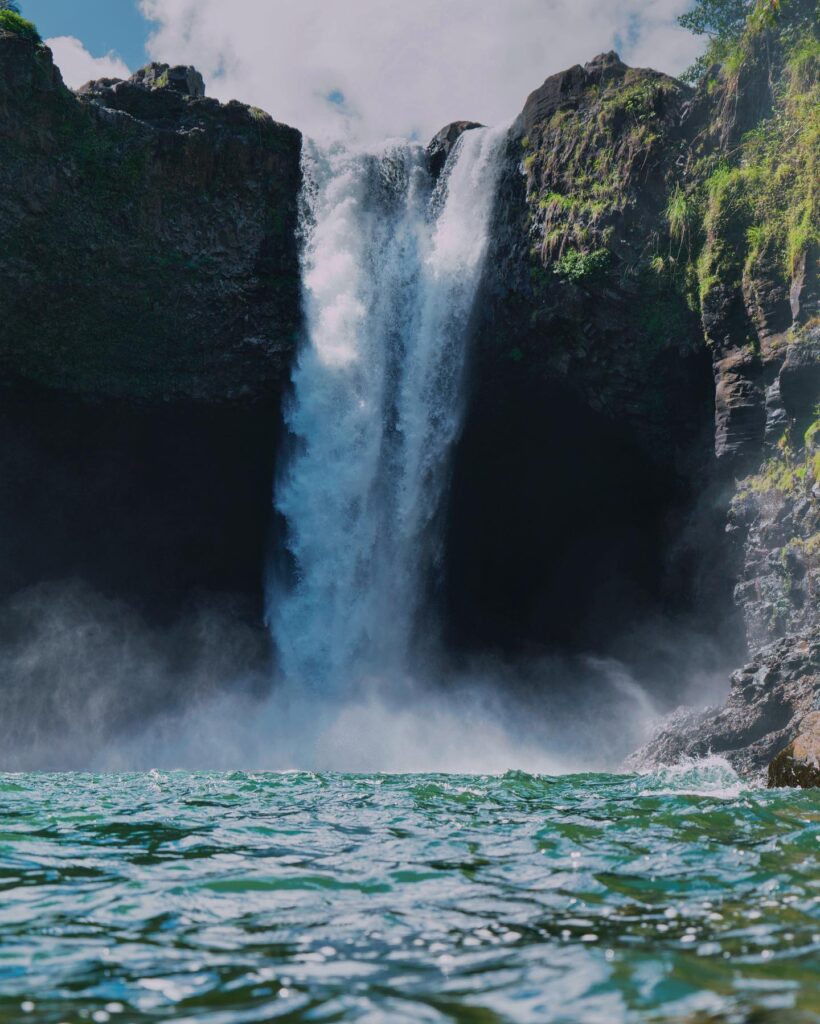 Tropical rain clouds over Rainbow Falls near Hilo