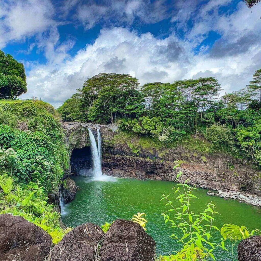 Sunny morning view of Rainbow Falls near Hilo during summer
