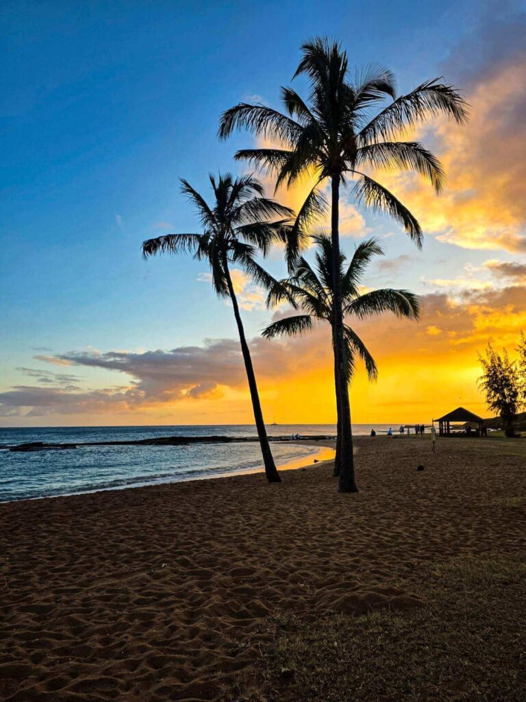 Colorful sunset over Salt Pond Beach on Kauai's West Side