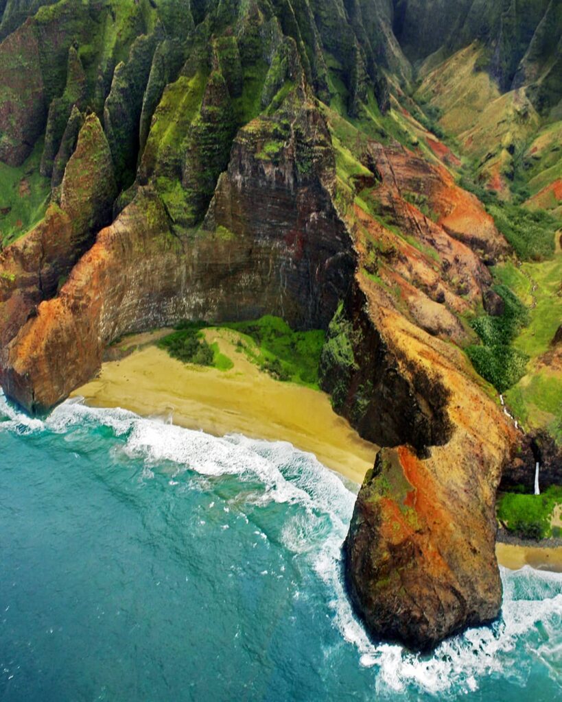 Secluded stretch of sand and cliffs at Secret Beach in Kauai