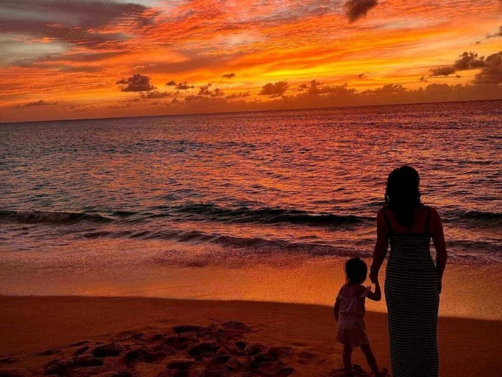 Wide sandy shoreline and surf at Sunset Beach on Oahu’s North Shore