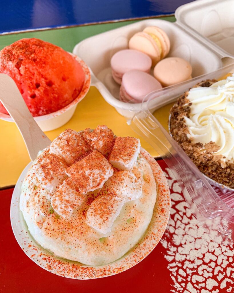 Brightly colored shave ice with tropical syrup flavors at Ululani’s