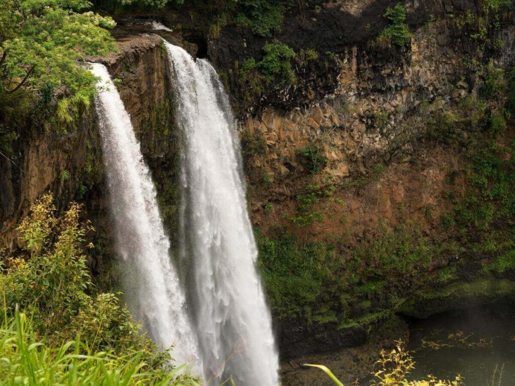 Wailua Falls waterfall in Kauai viewed from roadside lookout