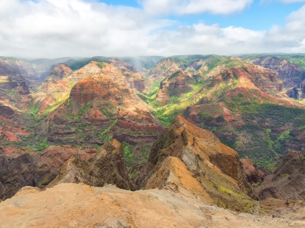 Waimea Canyon lookout with red cliffs and deep valley on Kauai