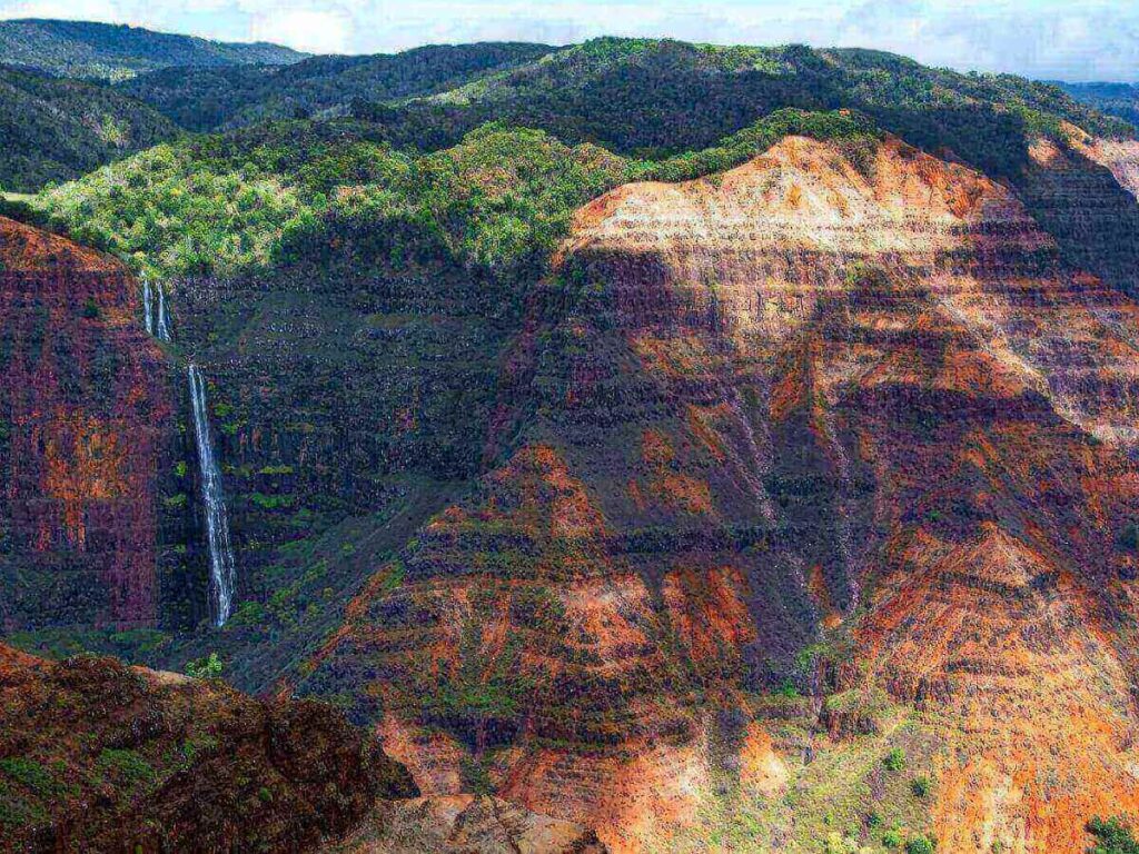 Waimea Canyon lookout in Kauai with layered cliffs and no visible buildings