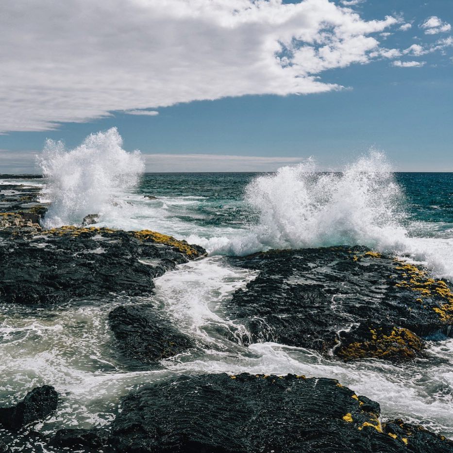 Rocky tidepools and calm waters at Wawaloli Beach Park near the Natural Energy Lab