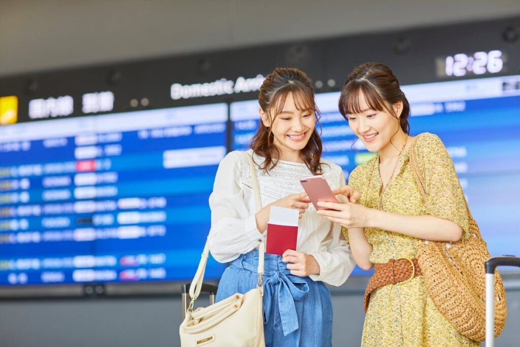Women checking flight tickets on an airport