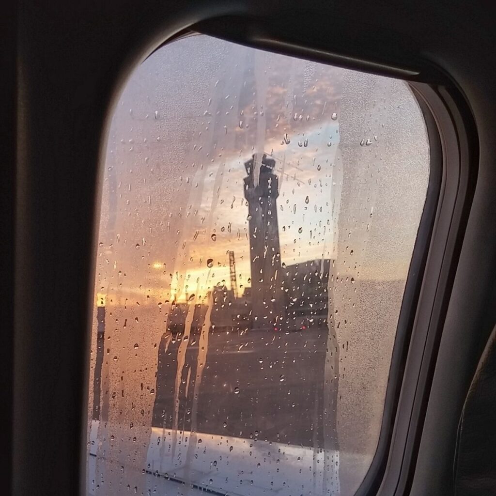 Flight window with rain drops