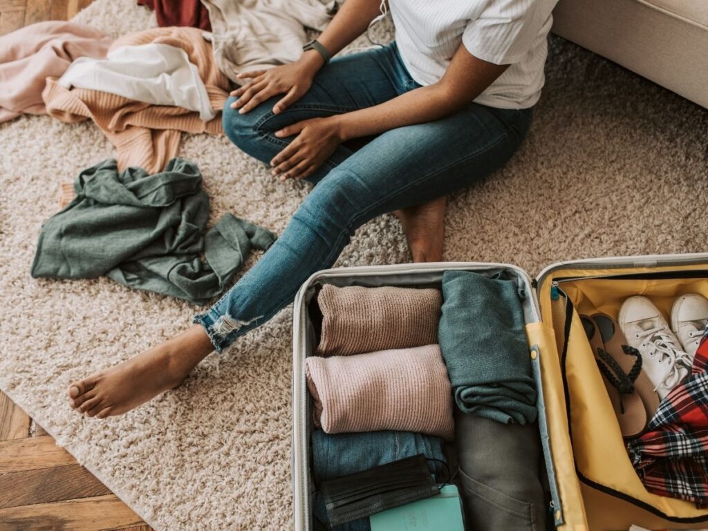 Close-up of luggage sitting on hotel carpet, potential bed bug risk